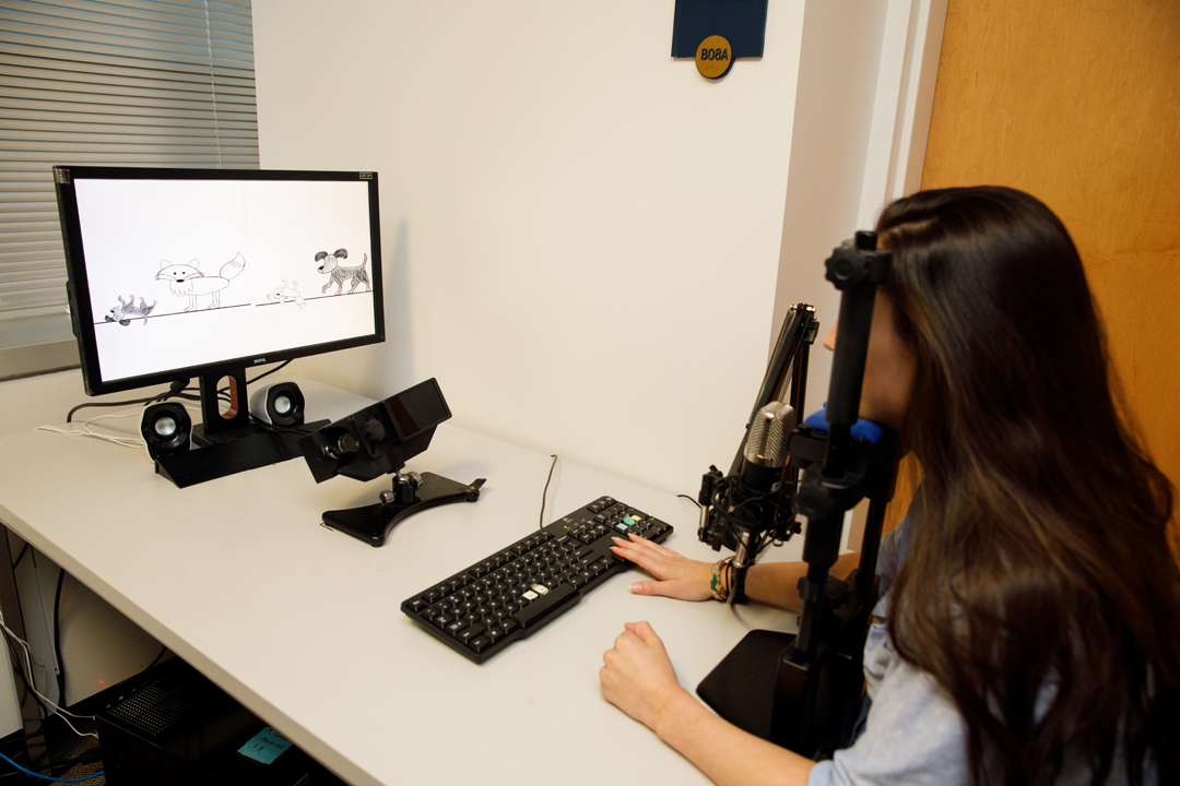 Graduate student Maria Braiuca demonstrates eye-tracking technology that charts which image patients are viewing in response to verbal cues.