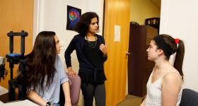 Malathi Thothathiri (center with student researchers) said her new study proves a “virtuous spiral during a child’s development” linking executive function to language skills. (Photo: William Atkins)